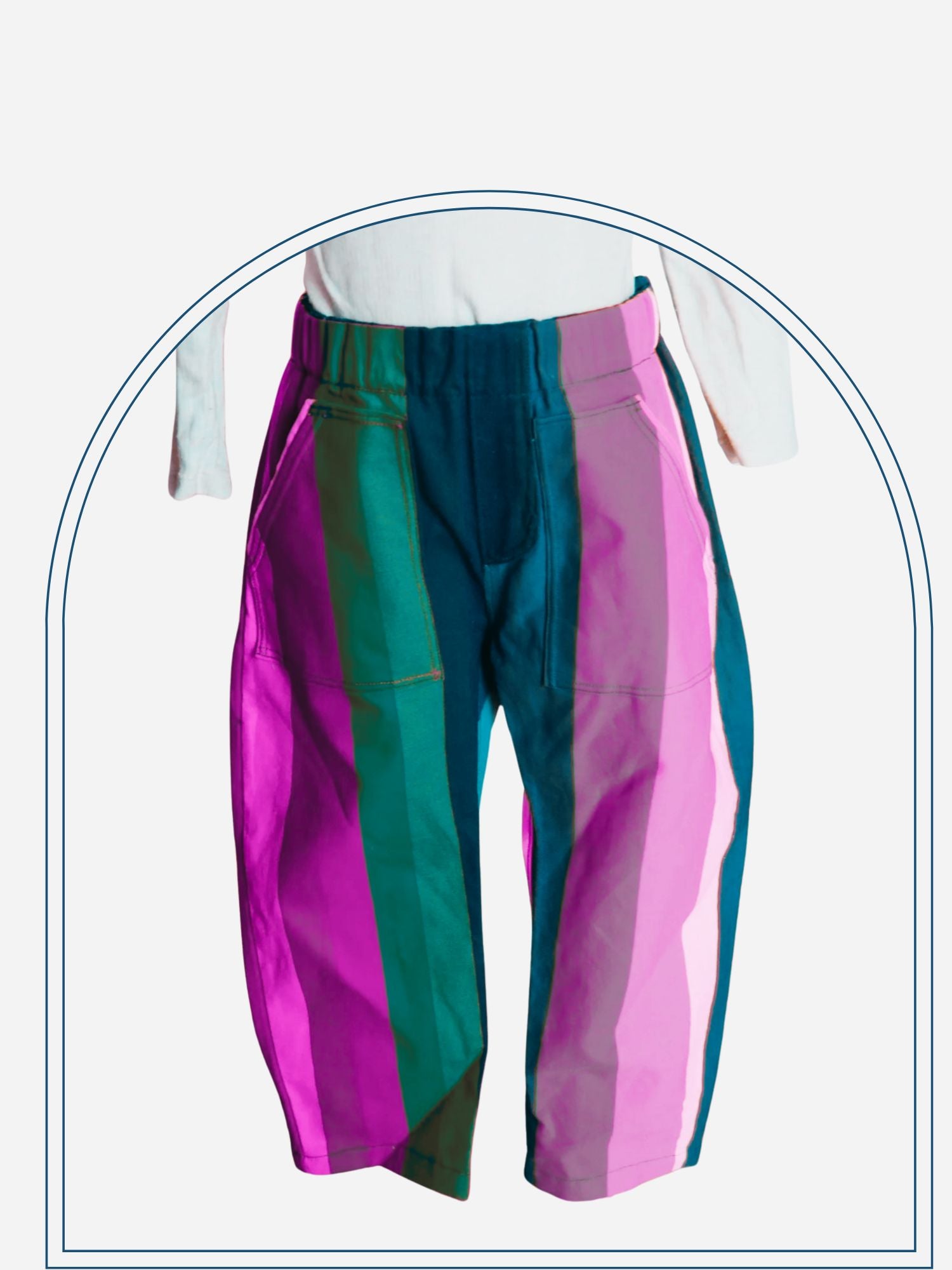 Rainbow striped pants worn by a person against a neutral background
